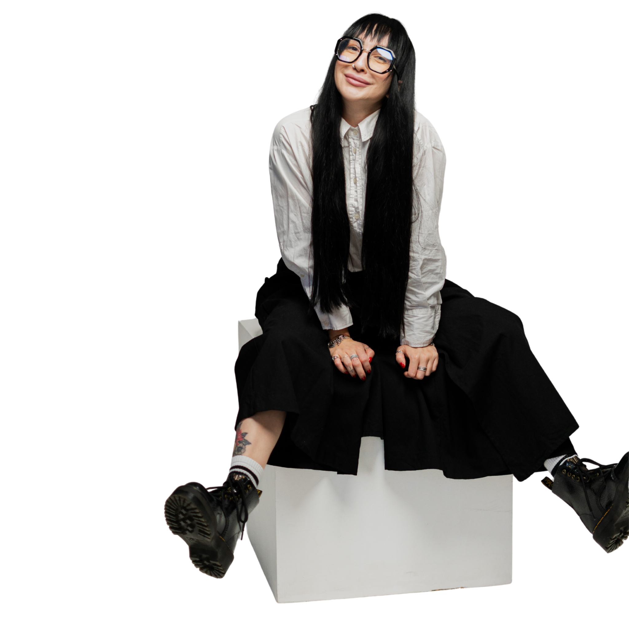 Alina Cosmas seated, smiling at the camera